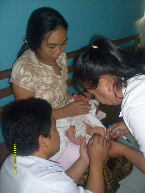 Clinicians assessing Pirani scores in Laos